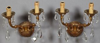 Pair of French Louis XV Style Brass Two Light Sconces, 20th c., the circular back plate issuing two prism hung curved arms, H.- 12 i...