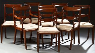 Set of Eight (6 +2) American Carved Mahogany Dining Chairs, late 19th c., the scrolled curved crest rail over a pierced horizontal s...