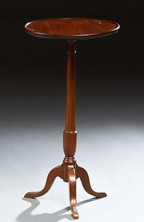 English Mahogany Candle Stand, 20th c., the round dished top on a tapered cylindrical support to a tripod base, H.- 29 1/2 in., Dia....