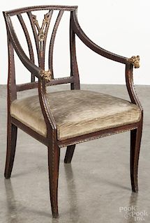 Italian mahogany and gilt decorated armchair, late 19th c., with ram's head grips.