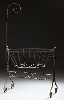 French Wrought Iron Cradle, 19th c., with a mosquito netting hook on one end, with canted rod sides, H.- 71 in., W.- 42 in., D.- 22...