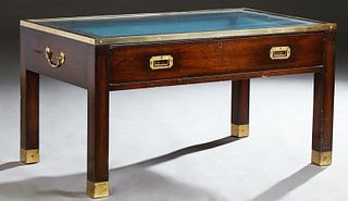 Unusual Campaign Style Brass and Mahogany Display Coffee Table, 20th c., the glass top over a lower fall front frieze drawer opening...