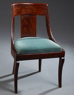 American Carved Mahogany Seignouret Style Gondola Chair, 19th c., the curved back over a curved vertical splat, to a slip seat, on s...