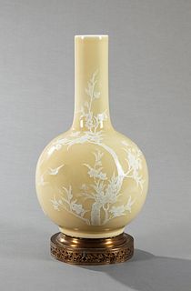Chinese Kuang Hsu Bottle Form Vase, c. 1900, with enameled floral and bird decoration, on a yellow ground, mounted on a pierced bras...