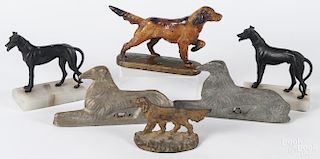 Cast iron, painted retriever doorstop, 19th c., together with a pair of black painted hounds