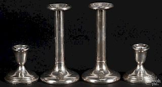 Two pairs of sterling silver weighted candlesticks, 19th/early 20th c., to include a Towle pair