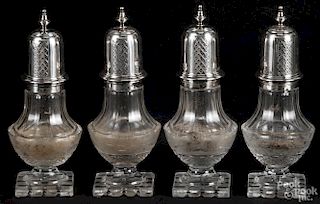 Set of four sterling silver and cut glass casters, early 20th c., the glass etched with stags