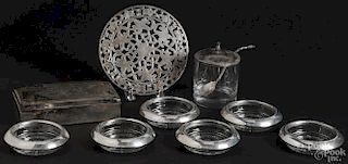 Set of six sterling silver mounted coasters, together with a hot plate, a mustard jar with a spoon