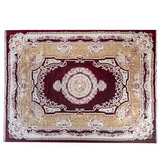 Tapete. Medio Oriente. SXX. Estilo Tabriz Imperial. Elaborado en fibras de algodón y sintéticas. 394 x 297 cm