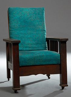 American Mission Oak Morris Chair, early 20th c., the canted adjustable upholstered back over an upholstered seat flanked by flat ar...