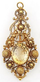 18K Yellow Gold Citrine Pendant, c. 1900, with a pierced floriform border around a lower app. 10 carat oval citrine, H.- 2 1/4 in.,...