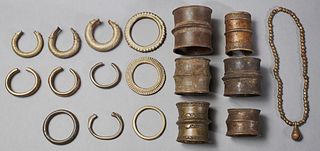 Group of Eighteen Pieces of African Bronze Jewelry, 20th c., consisting of six wide cuff bracelets, eleven bangle bracelets, and a b...