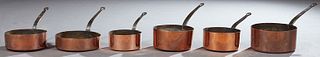 Set of Six French Graduated Copper Sauce Pans, early 20th c., with iron handles, Largest H.- 9 in., W.- 21 1/2 in., D.- 10 3/4 in.