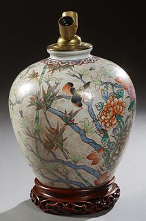 Chinese Style Porcelain Baluster Vase, 20th c., with gilt and polychromed bird and floral decoration, now on a carved wooden base mo...