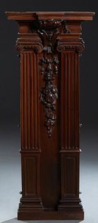 Victorian Carved Walnut Architectural Element, 19th c., the breakfront stepped crown over a shield flanked by engaged Ionic tapered...