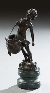"Boy with a Woven Basket," 20th c., patinated bronze figure, on an integral stepped circular green marble base, H.- 11 3/4 in., W.-...