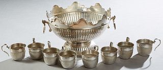 Nine Piece French Silverplated Punch Set, consisting of eight handled punch cups with reeded sides and a matching scalloped top punc...