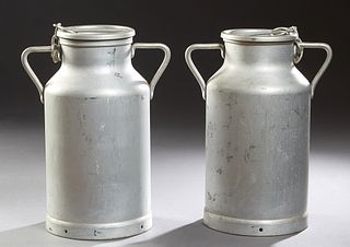 Pair of French Provincial Handled Aluminum Milk Cans, early 20th c., the lids linked by chains to the handle, H.- 20 in., W.- 14 3/4...