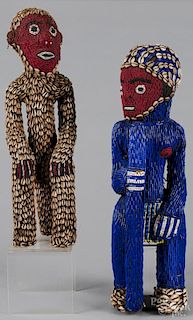 Cameroon grasslands ancestor figures, Bamileke people, with bead and cowrie shell decoration, 23'' h.