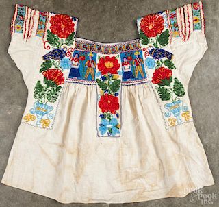Heavily beaded Mexican cotton blouse, 20th c., decorated with male and female figures