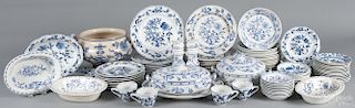 Ninety pieces of Meissen blue and white dinnerware in the Blue Onion pattern, to include plates