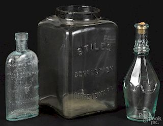Two pressed glass aquamarine bottles, 19th/20th c., to include one reading ''Dead Stuck''