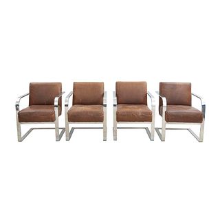 Lote de 4 sillones. Estados Unidos. SXXI. Estructura de metal plateado. Marca Ralph Lauren Home. Con respaldos y asientos en piel.