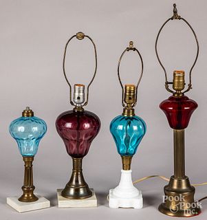 Four colored glass fluid lamps.