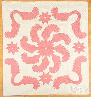 Two pink and white appliqué quilts, ca. 1900
