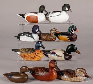 Ten miniature carved and painted duck decoys