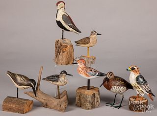 Seven carved and painted birds