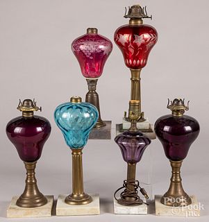 Six colored glass fluid lamps.