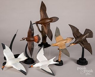 Six Reineri carved and painted flying birds