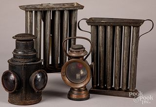 Two tin candlemolds, together with two lanterns.
