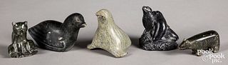Five Inuit carved stone figures