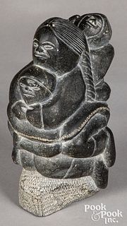 Inuit carved stone mother and children