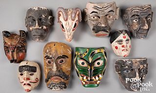 Ten carved and painted Mexican masks