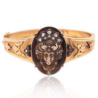 14KT GOLD BANGLE WITH CARVED GODESS, EARLY 20TH CENTURY