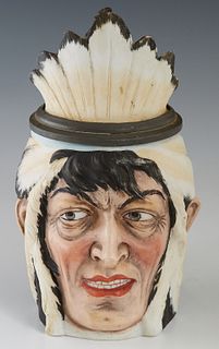 Ernst Bohne Native American Porcelain Character Stein, c. 1900, 1/2 Liter, in a feather headdress, H.- 7 1/2 in., W.- 4 1/4 in., D.- 5 3/4 in.