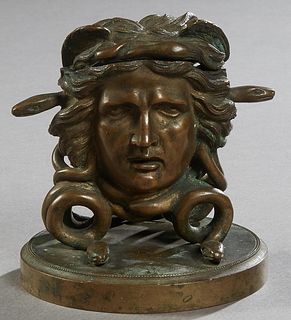 Unusual Patinated Bronze Medusa Inkwell, 19th c., on a stepped integral circular base, possibly a Grand Tour souvenir, H.- 4 in., W.- 3 3/4 in., D.- 3