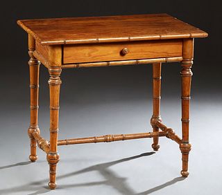 English Pitch Pine Faux Bamboo Writing Table, c. 1880, the rectangular top over a long frieze drawer, on turned tapered legs joined by an H-form stret