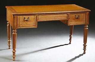 French Louis Philippe Carved Oak Desk, 19th c., the rounded edge rectangular top with an inset leather writing surface over two frieze drawers flankin