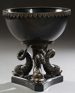 Spelter Mounted Black Marble Center Bowl, 20th c., with a spelter relief leaf rim over the tapered bowl, on patinated spelter dolphin fish supports, t