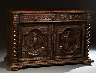 French Provincial Carved Oak Sideboard, c. 1880, the breakfront top with two frieze drawer over setback double cupboard doors with high relief carved 
