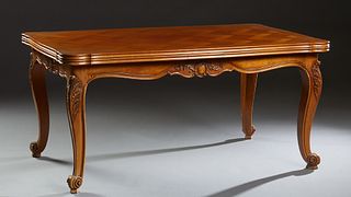 French Louis XV Style Carved Cherry Drawleaf Table, 20th c., the reeded edge rounded corner parquetry inlaid top over a serpentine skirt, on large scr
