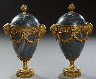 Pair of Louis XVI Style Gilt Bronze Mounted Gray Marble Urns, 19th c., the pomegranate finials over a domed top to a pierced gilt bronze band with flo