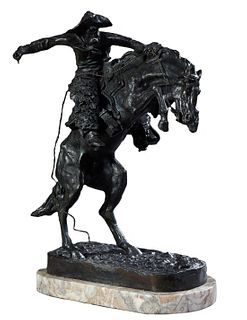 Frederic Remington (1861-1909), "The Wooly Chaps," c. 1900, patinated bronze, on a highly figured thick oval rouge marble base, with an incised signat