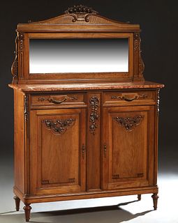 French Louis XVI Style Carved Walnut Marble Top Sideboard, early 20th c., the arched floral carved back with a wide beveled mirror, on a base with a B