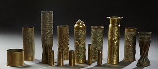 Group of Fourteen Trench Art Pieces, c. 1918, consisting of seven large vases with repousse decorations, a bed warmer with repousse decoration, three 