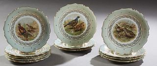 Set of Twelve French Limoges Porcelain Plates, 20th c., by Lucien Micheland, with gilt rims and tracery around game bird transfer reserves, H.- 1 in.,